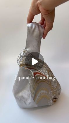 Shiho / Bag-making on Instagram: "First post in a while since I’ve been away, but back to work now!  I tried making another Japanese knot bag but with some slight improvements - this time it has a shorter handle and a pocket inside:)  #handmade #handmadebag #japaneseknotbag #kimonopattern #japanesepattern" Diy Knot Bag Free Pattern, Diy Knot Bag, Diy Japanese Knot Bag, Fabric Bags Handmade Handbags, Knot Bag Pattern, Kimono Ideas, Diy Clutch Bag, Japanese Tote Bag