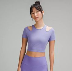 Description Cut-Out Details On The Shoulders Of This Yoga Top Add A Little Intrigue To Your Practice. Whether You Keep The Look Going Off The Mat Is Up To You. Size, Condition & Disclaimer This Item Is A Size 8, Color Dark Lavender, And Is Sold Nwt. Stock Photos Are Only Shown To Demonstrate Fit And Styling And May Occasionally Differ In Color. Please Closely Review The Provided Photos And Dimensions For The Actual Item Being Sold. Dimensions Pit To Pit 17" Body Length 16.5" Details Body: 86% Mo Purple Short Sleeve Activewear For Workout, Lavender Stretch Sports Top, Lavender Sports Top With Stretch, Stretch Lavender Sports Top, Lavender Athleisure Top For Yoga, Purple Workout Tops For Spring, Purple Workout Top For Spring, Purple Moisture-wicking Tops For Yoga, Purple Moisture-wicking Yoga Tops