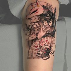 a woman's arm with an artistic tattoo design on the left side of her body