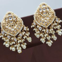 "Kundan Earring/Kundan Pearl Chandbali/Sabyasachi Kundan Jhumka/Chandbali earring/Kundan Indian wedding Jewelry/Bridal earring@AryaFashions Beautiful high quality semi precious stone Indian traditional Rajwadi Style Jadau Kundan Chandbali earrings for any occasion such as Wedding, Engagement, Baby Shower, evening party. These earrings are handcrafted with love and creativity and are perfect for any occasion may it be engagement, Wedding or any bridal ceremonies or social get-together. This set i Luxury Bridal Chandbali Earrings With Elegant Design, Luxury Chandbali Bridal Earrings With Cutdana, White Chandbali Pearl Earrings For Reception, Heavy White Chandbalis For Reception, White Kundan Chandbali Chandelier Earrings, White Kundan Chandelier Earrings For Receptions, White Chandbali Chandelier Earrings For Reception, White Kundan Chandbalis With Cutdana, White Chandbali Bridal Earrings For Reception