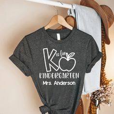 Custom Kindergarten Teacher Shirt,Kindergarten Teacher Gift, Personalized Teacher Team Shirt,Teacher Appreciate Gift,Custom Kindergarten Tee ----- How To Order ----- 1-) Please, check and review all the photos. 2-) Choose your t-shirt size and color. *Different styles of shirts may have different shades of same color choice due to different manufacturer brands. *For this reason, we recommend you to match shirts from the same styles if you want precisely matching colors (ex. Unisex, V-necks, Toddler, etc.). 3-) Click add to cart. You can go back to add more shirts. 4-)Click "Proceed to check out". 5-)When you check out, you can add a note to seller for any request. ----- Unisex Shirts ----- * Unisex t shirt fits like a well-loved favorite, featuring a crew neck, short sleeves and designed w Kindergarten Teacher Gift, Kindergarten Teacher Gifts, Kindergarten Teacher Shirts, Kindergarten Shirts, Teacher Team, Personalized Teacher Gifts, Kindergarten Teacher, Team Shirt, Matching Colors