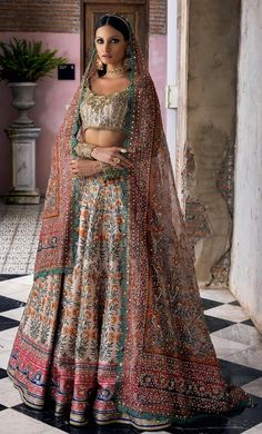 Indian Bridal Dress in Wedding Lehenga and Choli Style – Nameera by Farooq Pastel Floral Bridal Lehenga, Traditional Raw Silk Wedding Gown, Unstitched Brocade Lehenga With Dabka Work, Multicolor Embroidered Anarkali Set For Wedding, Traditional Brocade Gown For Reception, Traditional Brocade Gown With Resham Embroidery, Raw Silk Dress With Multicolor Embroidery For Wedding, Traditional Dola Silk Wedding Gown, Brocade Gown With Intricate Embroidery In Traditional Drape