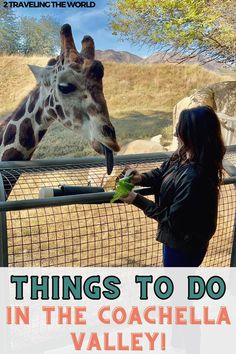 This posts reads things to do in the Coachella Valley. A woman is standing in front of a Giraffe feeding the Giraffe lettuce. This is one of the best things to do in La Quinta California. Feeding Giraffes, California Outfits