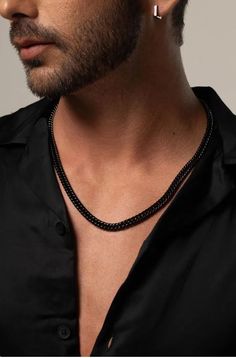 The 7.3mm Men’s Black Cuban Chain Necklace is a bold and versatile accessory, crafted from durable stainless steel. This Cuban link necklace is not only stylish but also waterproof, making it perfect for everyday wear. Whether as a gift for your husband or a statement piece for any occasion, this necklace adds a touch of modern sophistication to his look. Black Cuban Link Chain Necklace Gift, Modern Black Necklace With Curb Chain, Black Cuban Link Chain Necklace, Black Cuban Link Jewelry With Box Chain, Black Cuban Link Stainless Steel Chain Necklace, Black Cuban Link Stainless Steel Necklace, Black Stainless Steel Cuban Link Chain Necklace, Modern Black Stainless Steel Chain Necklace, Black Stainless Steel Chain Link Necklace