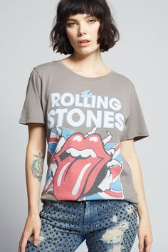 Not many bands have reached true icon status like The Rolling Stones! This vintage inspired tee features the band name, their famous lips and tongue logo, the Union Jack flag, and the year they were formed: 1962. Our classic boyfriend tee is made with soft cotton fabric, a loose crew neckline, distressed edges, and a raw cut bottom hem. Details Style #302507 Color: Steel Gray The Rolling Stones 1962 Boyfriend T-Shirt 100% Cotton Care/Import Machine Wash Cold, Tumble Dry Low Designed and Finished Rolling Stones Tee, Jack Flag, Union Jack Flag, Diva Boutique, Boyfriend T Shirt, Grey Tee, Boyfriend Tee, Real Girls, Edgy Look