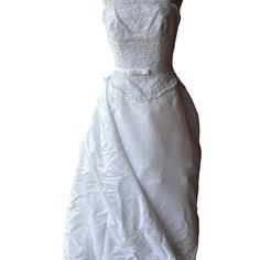 a white wedding dress on a mannequin