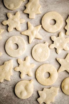 doughnuts and pretzels are arranged on a baking sheet to make christmas cookies