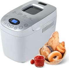 a bread maker and basket of bagels on a white background with a small jar of ketchup next to it