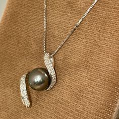 Final Price. No Trades. Nwt Brand New With Tags. Solid, Stamped 14k White Gold Pendant And Neck Chain. Necklace Is Approximately 18” In Length. Box Link Chain Is Secured With A Lobster Claw Style Clasp. Modern Swirl Design Pendant Features A Tahitian Pearl With Natural, Round Cut Diamonds. Approximately 1/8dwt. Purchased Many Years Ago, Prices Have Significantly Increased Since Then. An Amazing Gift. Tahitian Pearl Necklaces For Anniversary, Fine Jewelry Tahitian Pearl Necklace For Anniversary, Tahitian Pearl Fine Jewelry Necklace For Anniversary, Tahitian Pearl Necklace For Anniversary, Elegant Tahitian Pearl Pendant Jewelry, Formal Tahitian Pearl Pendant Jewelry, White Gold Tahitian Pearl Necklace For Gift, Tahitian Pearl Necklace In White Gold, Tahitian Pearl Jewelry With Brilliant Cut