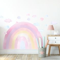 a child's room with a wall painted in pastel colors