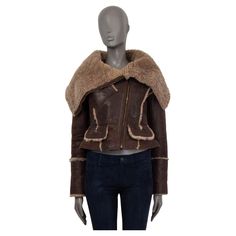 100% authentic Burberry Prorsum shearling aviator jacket in beige and brown sheepskin (100%). From the iconic fall/winter 2010 collection. Has two flap pockets and one buttoned pocket on the front. Features a wide collar and zip cuffs. Opens with a diagonal zipper on the front. Runs small and fit like an XS. Has been worn and is in excellent condition. Measurements Tag Size 40 Size XS Shoulder Width 42cm (16.4in) Bust 90cm (35.1in) to 98cm (38.2in) Waist 72cm (28.1in) to 78cm (30.4in) Hips 88cm Brown Shearling Biker Jacket With Faux Fur Trim, Designer Long Sleeve Sheepskin Leather Jacket, Brown Shearling Biker Jacket With Padded Collar, Designer Brown Shearling Outerwear, Designer Brown Outerwear With Faux Fur Lining, Luxury Brown Winter Biker Jacket, Luxury Brown Biker Jacket For Winter, Designer Brown Sheepskin Outerwear, 2010 Clothes