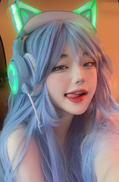 a woman with long blue hair wearing headphones and cat ears on top of her head