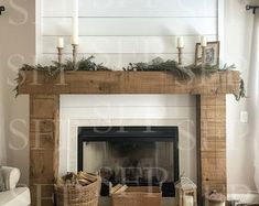 a living room filled with furniture and a fire place in front of a white fireplace