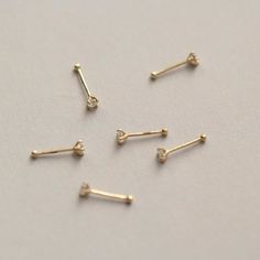 Style A tiny and cute 14K gold nose stud, without breaking the bank. You could never go wrong with such a classic design. It is a dazzling symbol of your personality. Metal It is made of 14K yellow gold. 14K gold contains 58.5% gold and 41.5% alloy. Compared to 10K, 18K, and 24K, it is the most popular choice, nearly 90% of all wedding rings and engagement rings sold in the United States consist of 14K gold. It’s durable and will not easily tarnish. Packaging It is ready as a gift! This 14K gold nose bone stud is made with love and will arrive in a jewelry box. Whether for yourself or for the one you love, it is an excellent choice. Dainty Prong Setting Nose Studs As Gifts, Dainty Yellow Gold Piercings With Single Diamond, Dainty Gold Piercings With Birthstone, 14k Gold Nose Studs With Prong Setting Gift, 14k Gold Prong Setting Nose Studs For Gift, Dainty Yellow Gold Nose Studs For Gift, Tiny Dainty 14k Gold Nose Studs, Dainty Yellow Gold Nose Studs As Gift, Minimalist Gold Piercings With Single Diamond