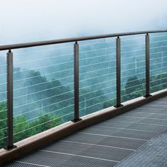 there is a metal railing on the top of a building with trees in the background