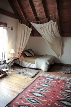 a bedroom with two beds and rugs on the floor