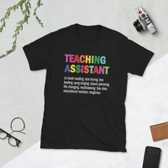 Funny teacher's aide gift for educational assistants. Perfect choice for teaching assistants, who assist a teacher. Great teacher appreciation day idea for teaching assistants. * 100% ring-spun cotton * Sport Grey is 90% ring-spun cotton, 10% polyester * Dark Heather is 65% polyester, 35% cotton * 4.5 oz/y² (153 g/m²) * Pre-shrunk * Shoulder-to-shoulder taping * Quarter-turned to avoid crease down the center * Blank product sourced from Bangladesh, Honduras, Haiti, Mexico, or Nicaragua Teaching Assistant Outfit, Assistant Outfit, Teacher Aide Gifts, Writer Shirts, Educational Assistant, Reading Specialist, Outfit For Men, Teacher Assistant, Papa Shirt