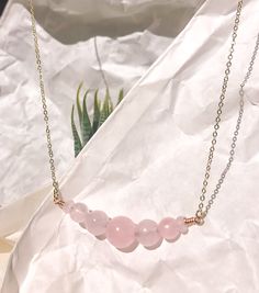 This beautiful and elegant Rose Quartz necklace - features the gentle and soothing gemstone that symbolizes the essences of unconditional love and a warm embrace. This bracelet is handcrafted with premium gold plated anti-tarnish brass wire. Designer grade A faceted rose quartz imported from Japan will dress up any outfit and its simple design allows it to be stackable with any other pairings! All pieces are made with lots of love! I hope that my creations can spark some joy into your hearts &lt Elegant Healing Jewelry For Mother's Day, Elegant Adjustable Rose Quartz Crystal Necklace, Minimalist Rose Quartz Birthstone Jewelry, Minimalist Rose Quartz Crystal Necklace Gift, Minimalist Rose Quartz Crystal Necklace For Gift, Minimalist Rose Quartz Pendant Necklace, Elegant Rose Gold Crystal Necklace For Healing, Elegant Birthstone Necklace With Natural Stones For Everyday, Minimalist Rose Gold Crystal Necklace