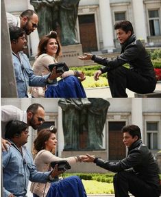 the actors are talking to each other in front of a fountain and statue with their hands together