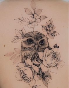 an owl with flowers on its back