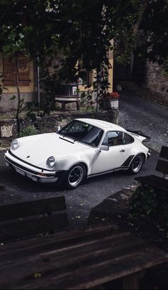 a white car parked on the side of a road