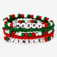 three bracelets with merry and jungle beads on each beaded one is red, white, green and silver