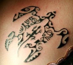 a tattoo on the back of a woman's stomach