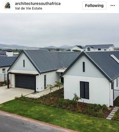 an aerial view of a house with two garages