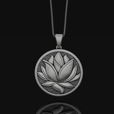 This exquisite Lotus Pendant Necklace is perfect for any occasion. Crafted from Sterling Silver, this pendant showcases the classic Lotus Flower design for timeless elegance. A unique and personalized gift for the special woman in your life, this necklace will become a treasured favorite. The Lotus Flower symbolizes the enduring beauty of the soul that is capable of rising out of life’s difficulties and reaching out towards the sun. Why not give the gift that perfectly represents the strong and Graceful Woman, Om Necklace, Engravable Jewelry, Lotus Flower Design, Towards The Sun, Lotus Necklace, Yoga Necklace, Lotus Pendant, The Lotus Flower