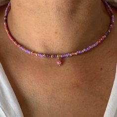 "This purple mauve seed bead necklace is so charming !    The fashion favorite colors right now ! Colors ? Yes ! It's your little extra \"Je ne sais quoi\"  Wear your necklace on its own, in a seek style or as a bohemian accumulation * Materials:  14K GOLD FILLED high quality clasp and extension chain. Gold-filled is a thick layer of gold on metal, a higher-quality material than gold-plated. Pendant : Faceted glass bead diam 6mm Best quality glass seed beads. * Size: The necklace is a choker that measures 39 cm + an extension chain of 3 cm.  * Customization If you want a different length or a particular color, write me a message. I will be happy to make your unique design !   * Delivery The parcel is shipped within 1 to 2 days by 📩 TRACKED PARCEL SERVICE 📩 Your jewelry comes in a pretty Purple Beaded Jewelry, Purple Bead Necklace, Plus Style, Layered Beaded Necklaces, Purple Mauve, Diy Jewelry Unique, Necklace Bead, Seed Bead Patterns, Necklace Purple