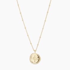 Designed with the aesthetic of a found object, this unique coin necklace as the feel of a family heirloom. This coin charm centers on an ever-so-dainty ball chain that effortlessly elevates your layered look. Chain extends out to 19"Coin is 3/4" acrossSpring ring closureAvailable in 18k gold plated brass Wave Texture, Gorjana Jewelry, Black Labradorite, Compass Pendant, Gold Coin Necklace, Orange Agate, Compass Necklace, Coin Pendant Necklace, Medallion Necklace