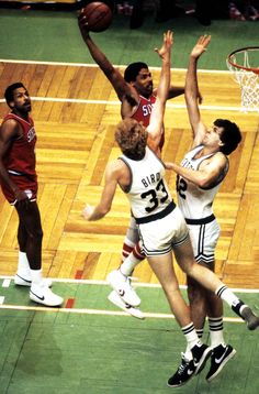 two men are playing basketball against each other