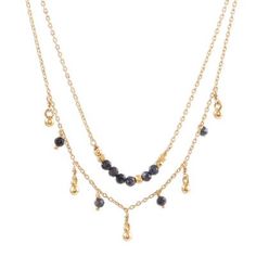 Dancing gloriously gemstones of natural iolite dangle alongside charms of sterling silver bathed in 22k gold. India's Vivek Nathany designs this necklace which circles the neck with two lengths of gold plated cable chain; one chain hosts the charms while another chain is centered by a beaded strand. Gold Beaded Necklaces With Gemstone Dangle, Gold Dangle Beaded Necklace With Gemstone Beads, Gold Dangle Beaded Necklace With Gemstones, Gold Double Strand Jewelry With Dangling Beads, Gold Dangle Charm Necklace With Natural Stones, Gold Spiritual Necklace With Dangling Beads, Spiritual Gold Necklace With Dangling Beads, Gold Dangle Jewelry With Gemstone Beads, Gold Crystal Dangle Necklaces With Faceted Beads