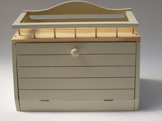 an empty toy chest with drawers on it