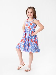 Meet the Bea dress. The Bea has sweet tie-shoulder details, a twirly skirt, and elasticated back. Made from our lightweight linen fabric, this dress will keep her cool and comfortable all summer long. Twirly Skirt, Comfort Design, Above The Knee, Linen Fabric, Wild Flowers, Poppies, Flip Flops, Skirt, Fabric