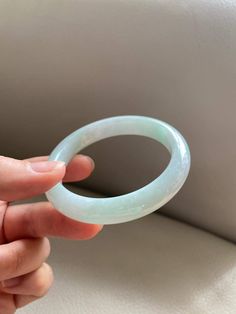 "🌈 Jade Bangle 54.8mm (2.16\"), Round Shape, Light Green 🌷 Untreated Natural Jadeite/ Grade A Jade 🌷 Certification : Yes 🌷 Jade from Myanmar/ Burma 🌷 Shape : Round 🌷 Inner diameter : 54.8mm / 2.16\" 🌷 Width & Thickness : 10.9 x 8mm 🌷 Color : Light Green 🌷 Free standard shipping from Hong Kong with tracking included 🌷 Take approximately 7-21 days to arrive worldwide ❤️ In Chinese Culture: Young people wear jade pendant will have a prosperous life, attracts good luck and friendship O Round Crystal Bracelet With Natural Stones, Round Jade Crystal Bracelet With Gemstone, Jade Gemstone Crystal Bracelet, Spiritual Round Bangle With Natural Stones, Handmade Round Jade Bangle, Adjustable Green Jade Bangle, Jade Bracelet Chinese, Hand-strung Round Jade Bracelets, Jade Bracelet Bangles Chinese