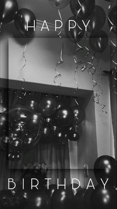 black and white photograph of balloons with the words happy birthday