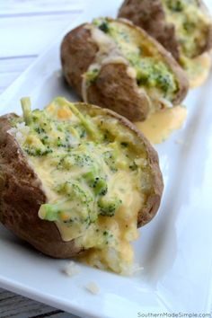 baked potatoes with broccoli and cheese on a white plate