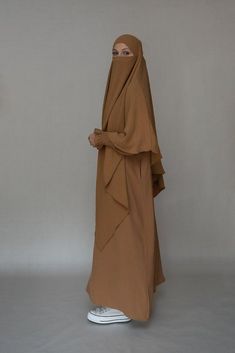 Avalom prayer gown umrah abaya dress non-wrinkling in brown - ANNAH HARIRI Solid Long Thobe For Eid, Long Thobe For Eid, Modest Solid Color Floor-length Abaya, Modest Floor-length Abaya, Modest Brown Maxi Dress, Long Solid Color Hijab For Eid, Long Solid Niqab For Eid, Solid Long Niqab For Eid, Brown Long Dress For Eid