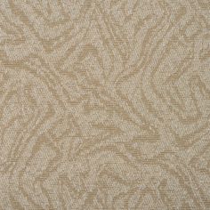 an upholstered beige fabric textured with small, wavy lines and swirls