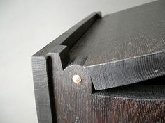 a close up of a piece of wood with a hole in the middle that is missing