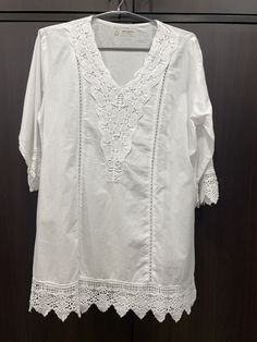 Introducing the perfect attire for you or a gift for your sister, daughter or your mom, a stunning pure cotton tunic that combines style, comfort, and exquisite design. Crafted with utmost care and attention to detail, this tunic showcases the timeless artistry of chikankari embroidery, adding a touch of elegance to its overall appeal. Made from high-quality pure cotton fabric, this tunic ensures exceptional comfort, allowing  a relaxed and effortless style. The soft and breathable material gent Summer Cotton Cutwork Blouse, Summer Cotton Blouse With Cutwork, Summer Cutwork Cotton Blouse, White Cotton Blouse With Crochet Trim, Bohemian Cotton Lace Top With Short Sleeves, Bohemian Short Sleeve Cotton Lace Top, Casual Cotton Blouse With Cutwork Hem, Cotton Cutwork Tops, Cotton Tunic Kurta With Relaxed Fit