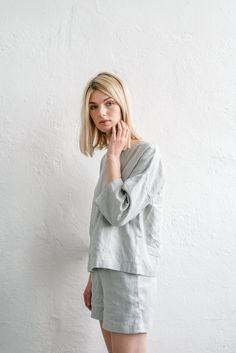 "When ordering you can choose to have the \"SHORTS\" or \"TOP\" only or the whole \"PAJAMA SET\" of both items. When buying a set you save 5 euro. Comfortable fit ELLA shorts with elastic band and fabric strap. CHLOE top with wide mid-length sleeves and boat neckline in ice grey TOP: - length is ± 64 cm (25\") (depends on size) - wide mid-length sleeves - boxy fit BOTTOM: - outseam ± 38 cm (14.9\") (depends on size) - inseam is ± 10 cm (3.9\") - elastic waistband with fabric strap - two side poc Drop Shoulder Blouse, Linen Nightgown, Linen Sleepwear, Shorts Linen, Linen Kimono, Kimono Blouse, Linen Pajamas, Linen Summer, Mid Length Sleeves