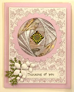 a card with an image of a flower and the words thinking of you on it