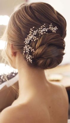 a woman wearing a bridal hair comb