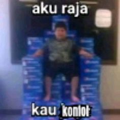 a young boy sitting on top of a chair with the words aku raja above him