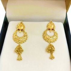 "Please contact us for any discounts or offers that are available on this item. We take absolute care of precious jewels are packed well so that there is no damage to the product. Your item will arrive in an elegant box, ideal for gifting to someone special. The weight of this earring in 18 KARAT SOLID YELLOW GOLD - 6.500 Grams Approximately Handling Time: We take handling time of 10 Business Days from the date of receipt of the payment after receiving cleared payment. Please check our designs l Traditional Gold Danglers For Anniversary, Gold Jhumkas For Anniversary, Gold Chandelier Earrings For Formal Festivals, 22k Yellow Gold Dangle Bridal Earrings, Formal Yellow Gold Bridal Earrings With Latkans, 22k Gold Chandelier Earrings With Latkans For Gift, Traditional Yellow Gold Chandelier Earrings For Formal Occasions, Traditional 22k Gold Chandelier Earrings As Gift, 22k Gold Danglers For Formal Occasions