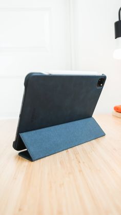 an ipad case sitting on top of a wooden table