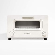 a white toaster oven sitting on top of a counter