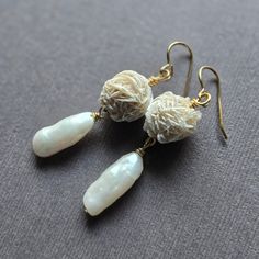 These dangle earrings feature beautiful and unique Desert Rose Selenite orbs which dangle above glowing biwa stick pearls. Selenite is a mineral with healing properties, skin enhancement and prosperity according to the website Crystals and Jewelry.  While I think it would be wonderful I'm not too sure about  all those amazing attributes but I was immediately enchanted by it's appearance!  They dangle about 2 inches in length from  their gold plated ear wires. Please let me know which earwire you Desert Rose Selenite, Biwa Pearls, Selenite Crystal, Bold Earrings, Head Pins, Desert Rose, Healing Properties, Earrings Gold, Ear Wires